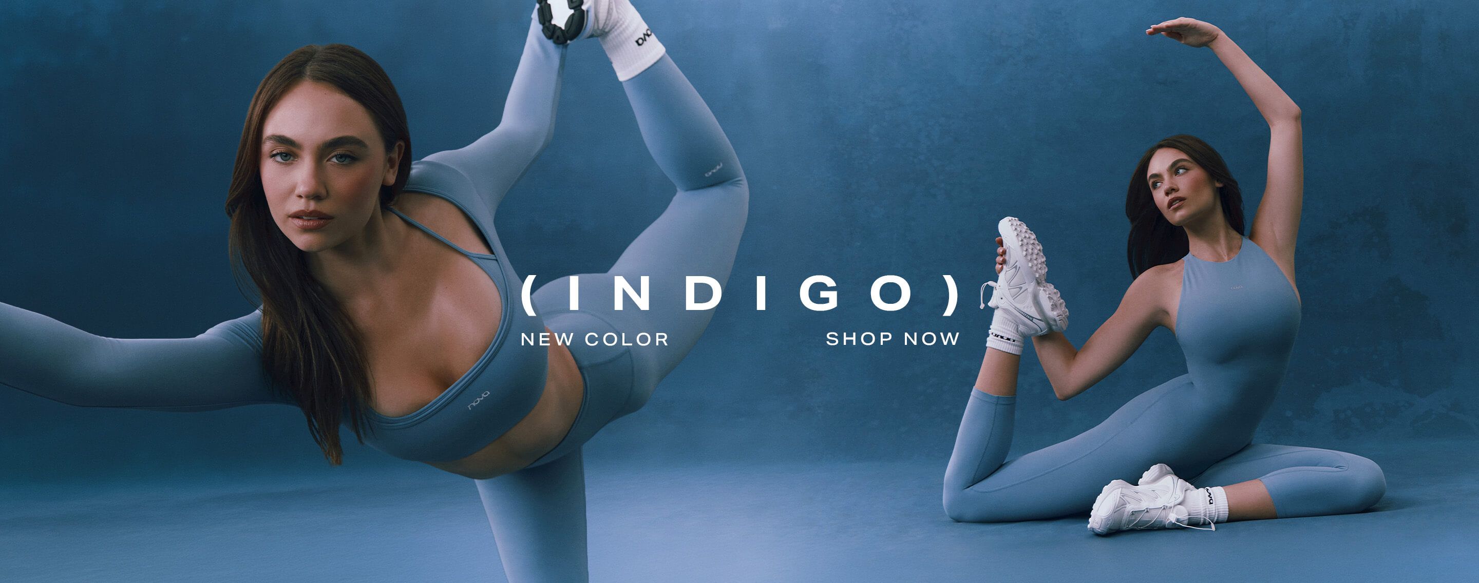 Woman in striking Soft Indigo activewear, featuring a long-sleeved crop top and matching leggings. Discover this new color for your workout.