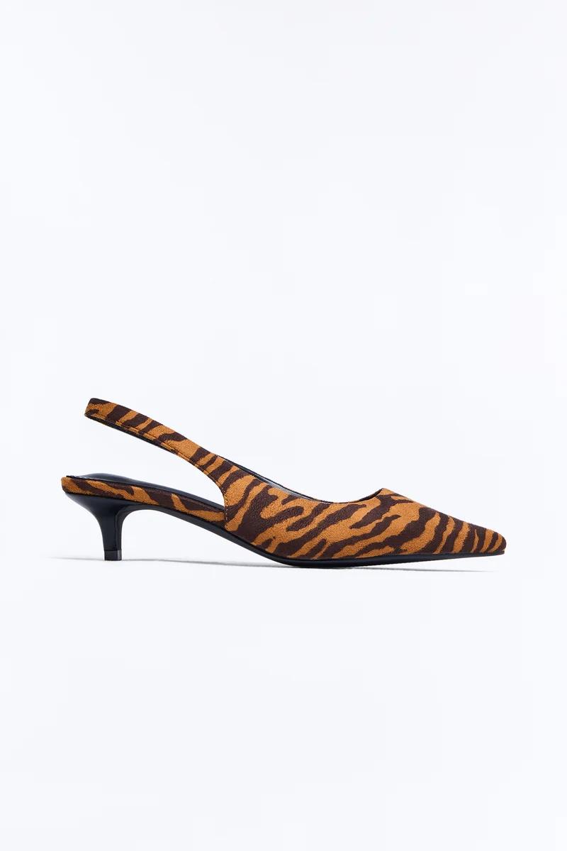 Brown tiger print slingback kitten heel shoes with a pointed toe.
