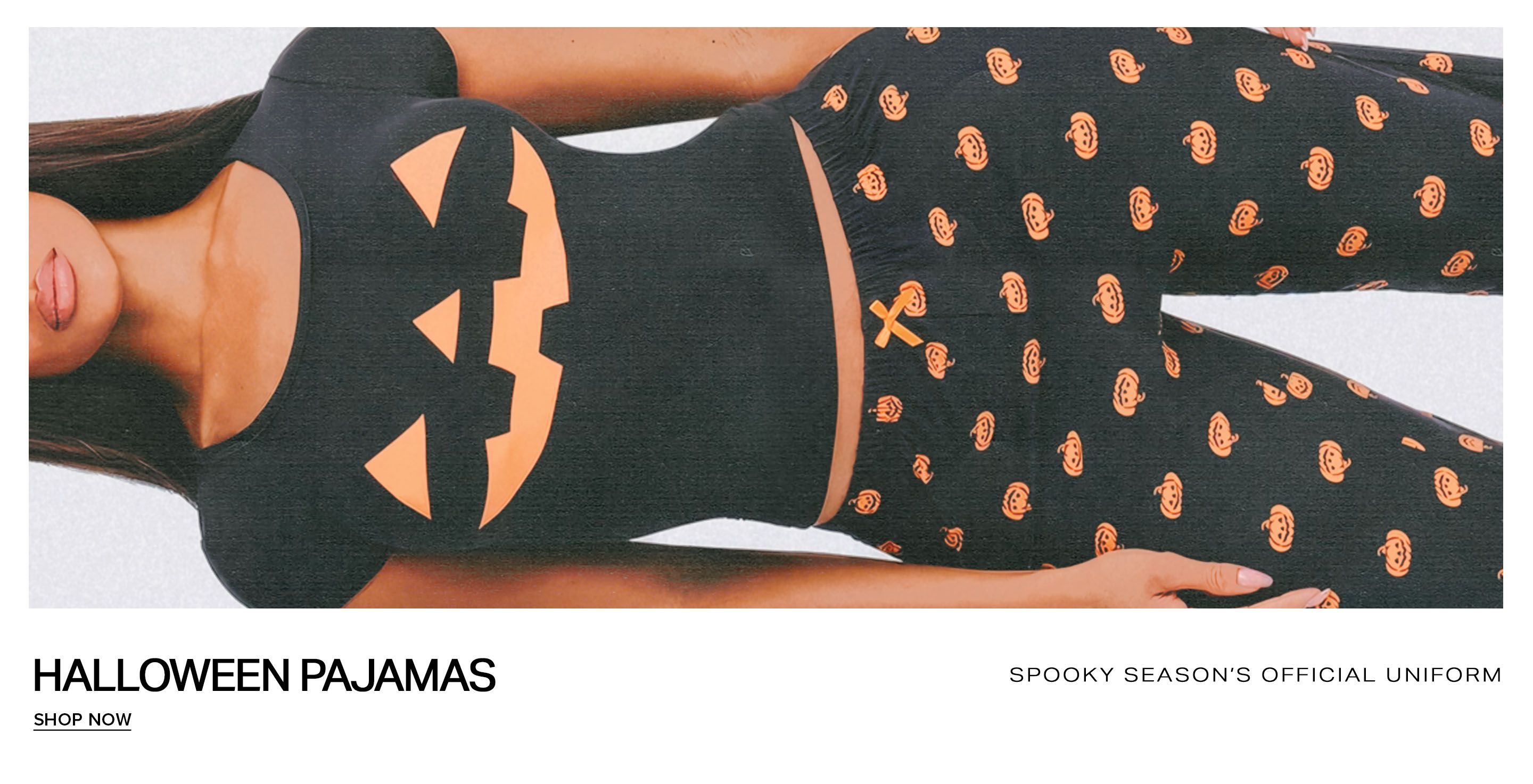 Shop Halloween pajamas featuring a dark grey pumpkin face tee and matching printed pants, perfect for cozy, spooky season style.