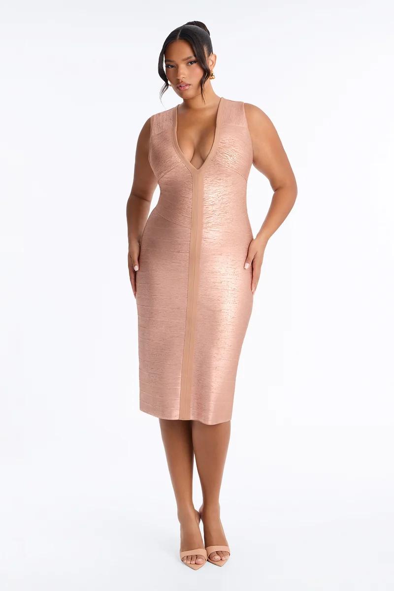 Curvy model wearing a metallic rose gold bandage midi dress with deep V-neck, showcasing a new elegant partywear collection.