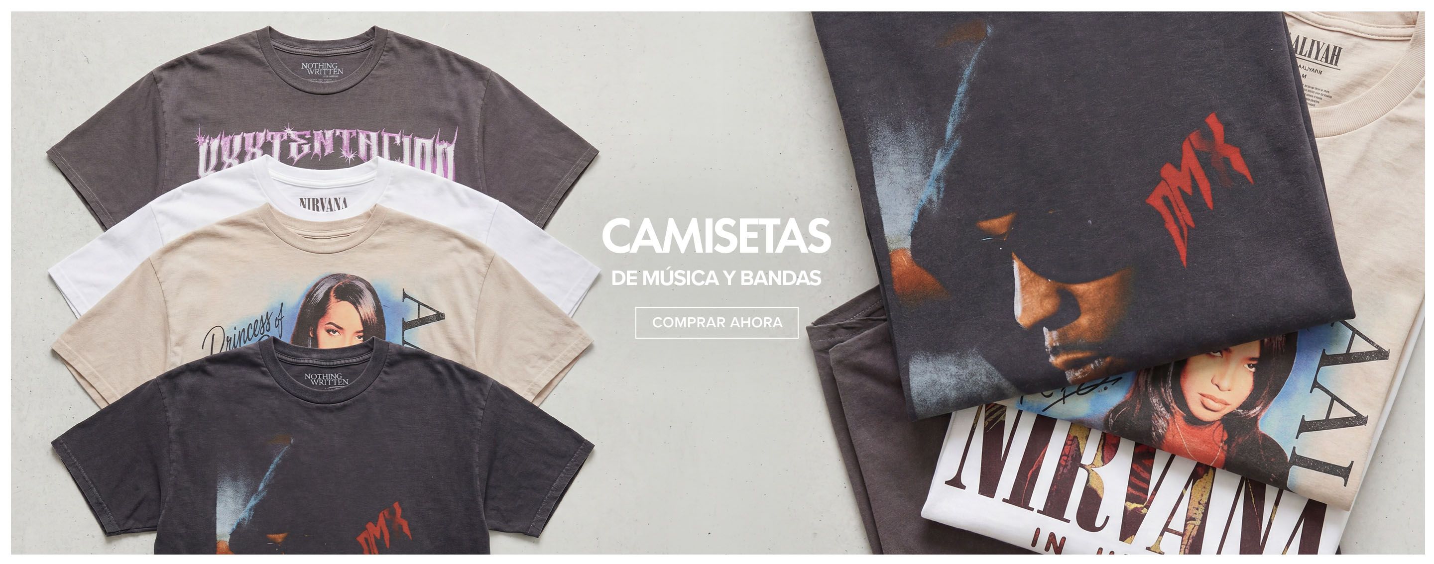 Camisetas de música y bandas dobladas en gris oscuro, beige y blanco con diseños gráficos audaces. ¡Compra la última colección de camisetas ahora!