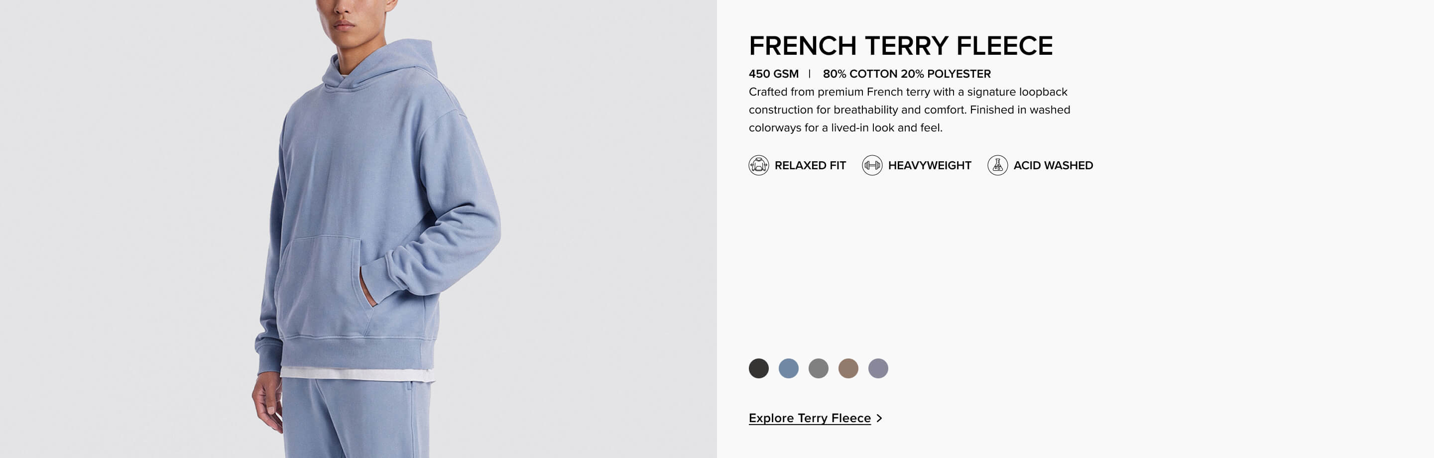 Man wearing a light blue relaxed fit French Terry fleece heavyweight hoodie. Explore the premium, acid washed cotton sweatshirt collection.
