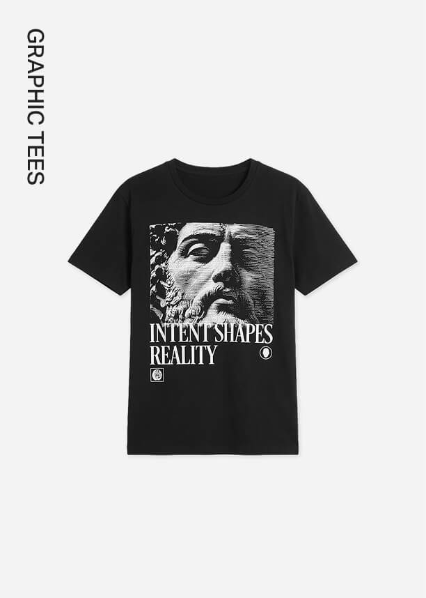 Black graphic tee showcasing a white classical statue print and 'Intent Shapes Reality' text, promoting the new graphic t-shirts collection.