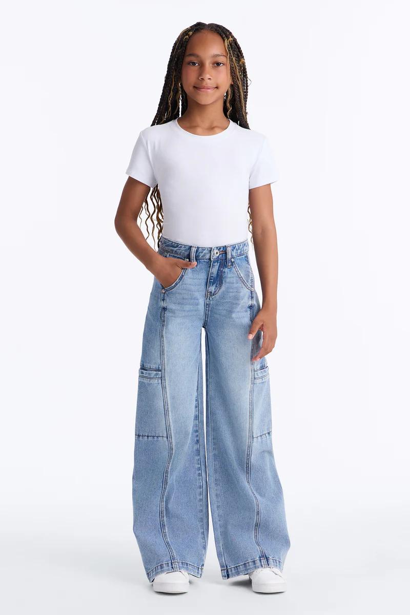 Girl's white short-sleeve tee and light wash wide-leg cargo jeans outfit.
