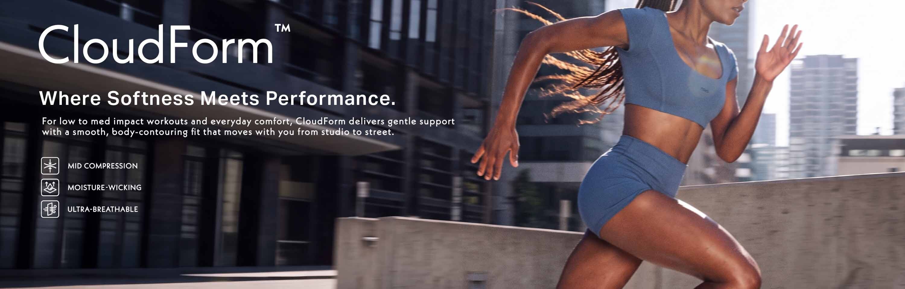 Woman running in a blue CloudForm activewear set against a city backdrop, promoting comfortable and high-performance compression sportswear.