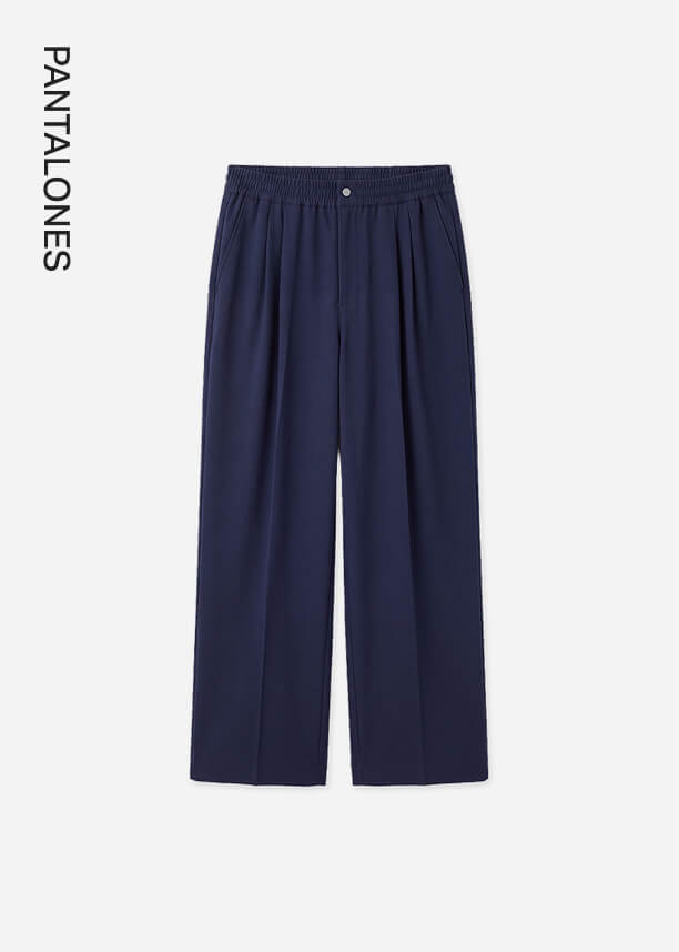 Pantalones de vestir azul marino con pinzas y cintura elástica sobre fondo claro, destacando la nueva colección de pantalones.
