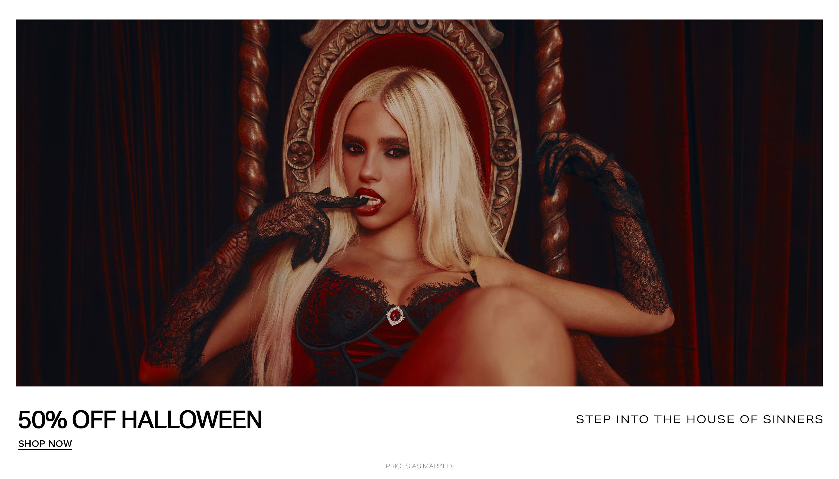 Blonde woman in red and black lace lingerie posing as a vampire on a Gothic throne, promoting a 50% off Halloween lingerie sale.