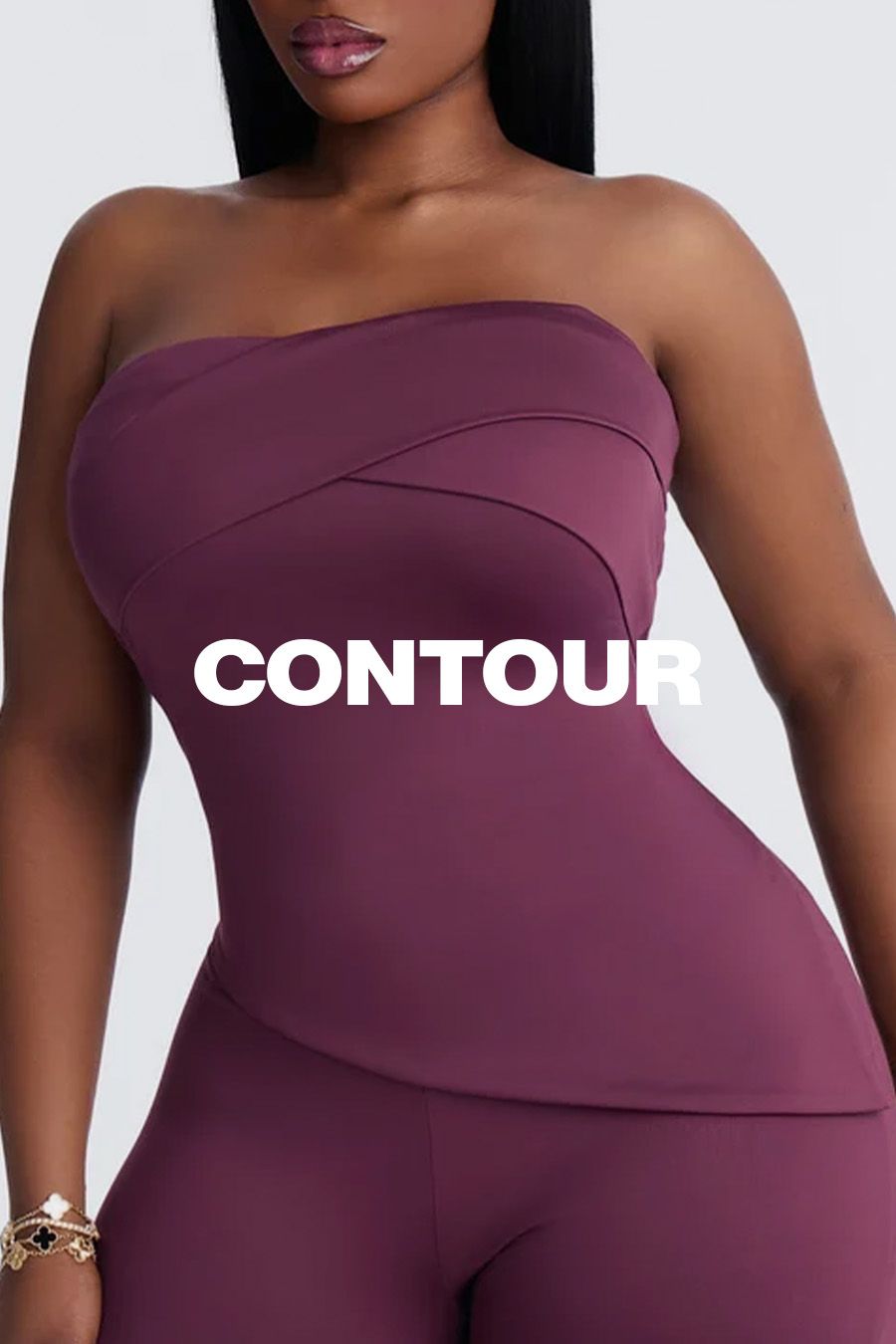 Model wearing a strapless plum-colored shapewear top with the overlay text CONTOUR, promoting a body-hugging contouring fashion collection.