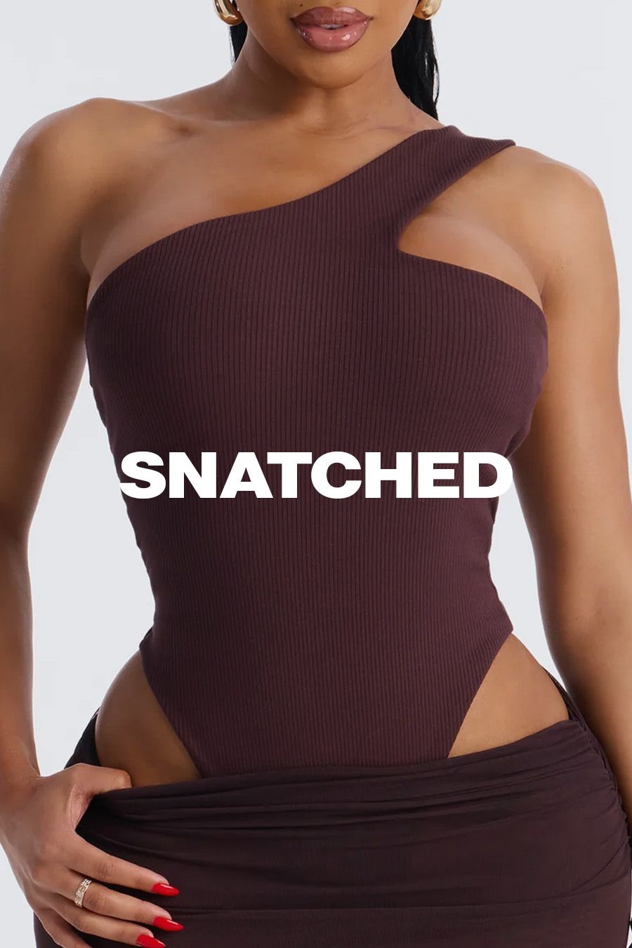 Dark brown ribbed one-shoulder bodysuit with cutout on model, promoting its figure-flattering 'snatched' style.