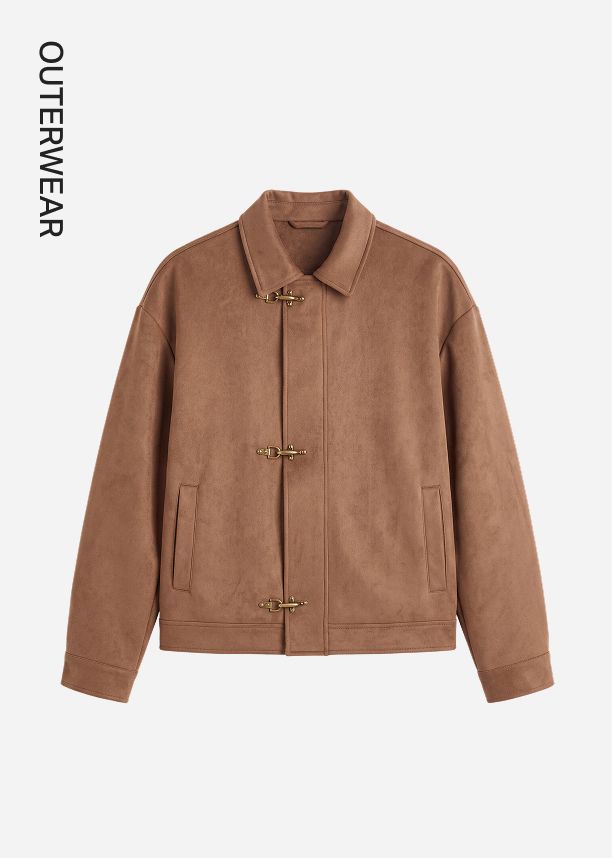 Brown faux-suede jacket with gold metal toggle closures and a classic collar, showcased as premium outerwear for the autumn fashion season.