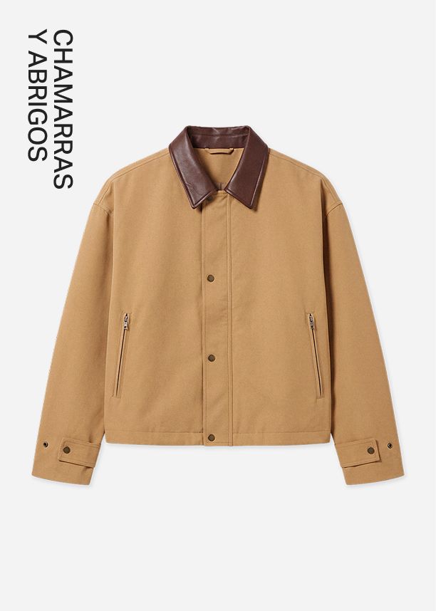 Elegante chaqueta beige con cuello de cuero marrón para la categoría de Chaquetas y Abrigos, con botones de presión y bolsillos con cierre.
