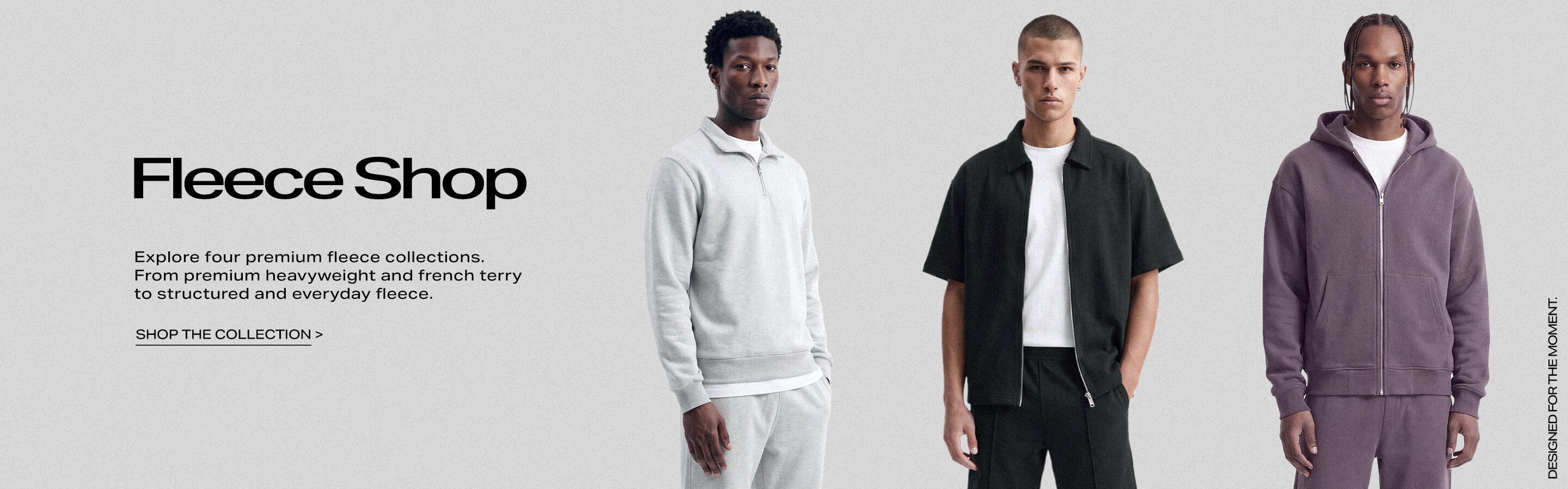 Three men modeling premium t-shirts in classic white, oversized olive green, and charcoal gray crew neck styles for the Tee Shop collection.