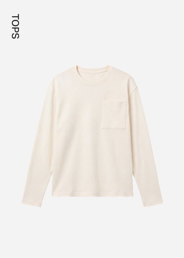Cream-colored ribbed long-sleeve t-shirt with a chest pocket, featured as a minimalist style option in the online shop tops category.