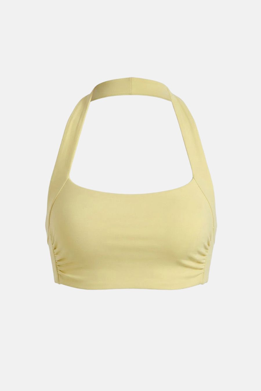 Top de bikini halter amarillo claro, con sutiles laterales fruncidos. Pieza clave de nuestra colección de trajes de baño de mujer, ideal para el verano.
