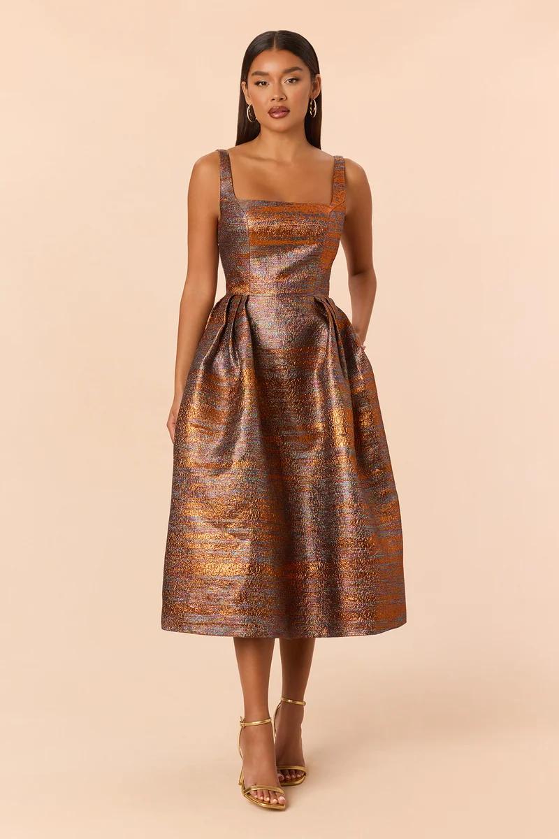 Elegant metallic bronze jacquard midi dress with pockets, perfect for formal evening parties, cocktail events, and holiday wedding guests.
