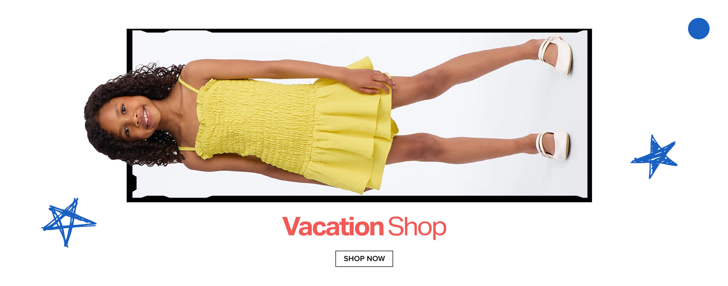 Smiling girl in a bright yellow smocked dress and white sandals, lying on a white background, highlighting our new Vacation Shop collection.