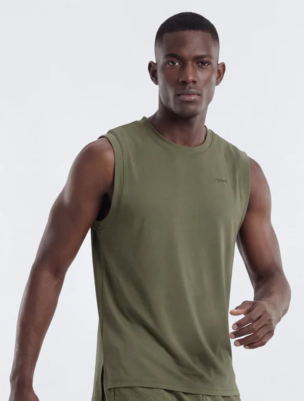 Black man in a Nova olive green sleeveless athletic shirt. Showing the new men's activewear collection against a white studio background.