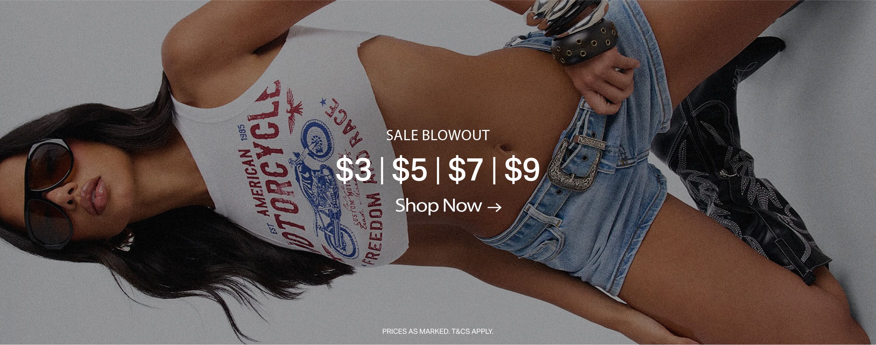 Woman in black sunglasses and white graphic crop top featuring a motorcycle design, promoting a fashion blowout sale from $3 to $9. Shop now for apparel deals.