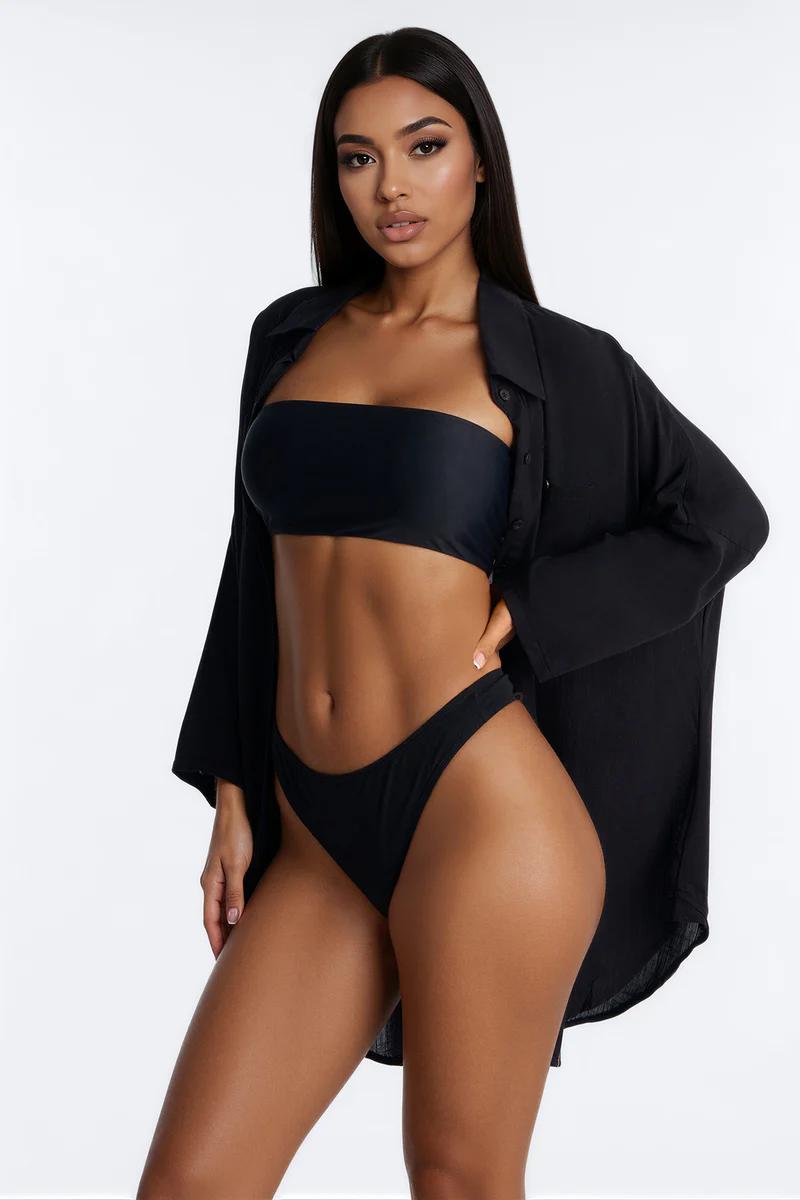 Black strapless bikini, high-cut bottoms & open oversized shirt. Chic beachwear & swimwear for women.