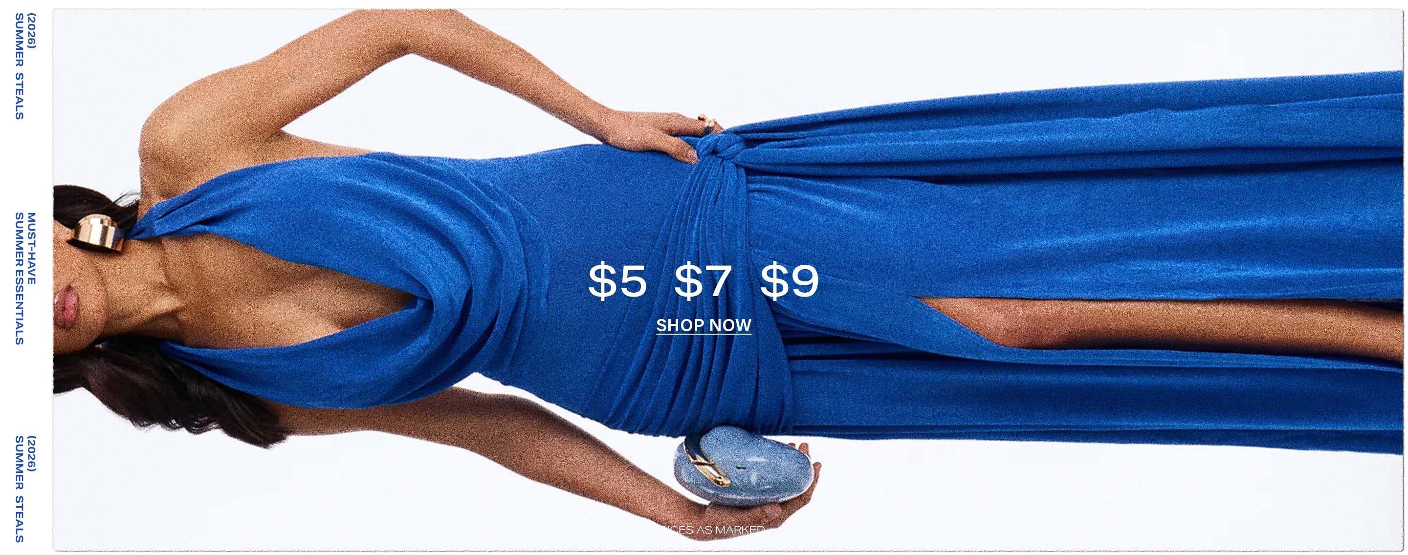 Woman in a vibrant blue summer dress, showcasing gold accessories & a clutch. Shop discounted summer fashion essentials now!
