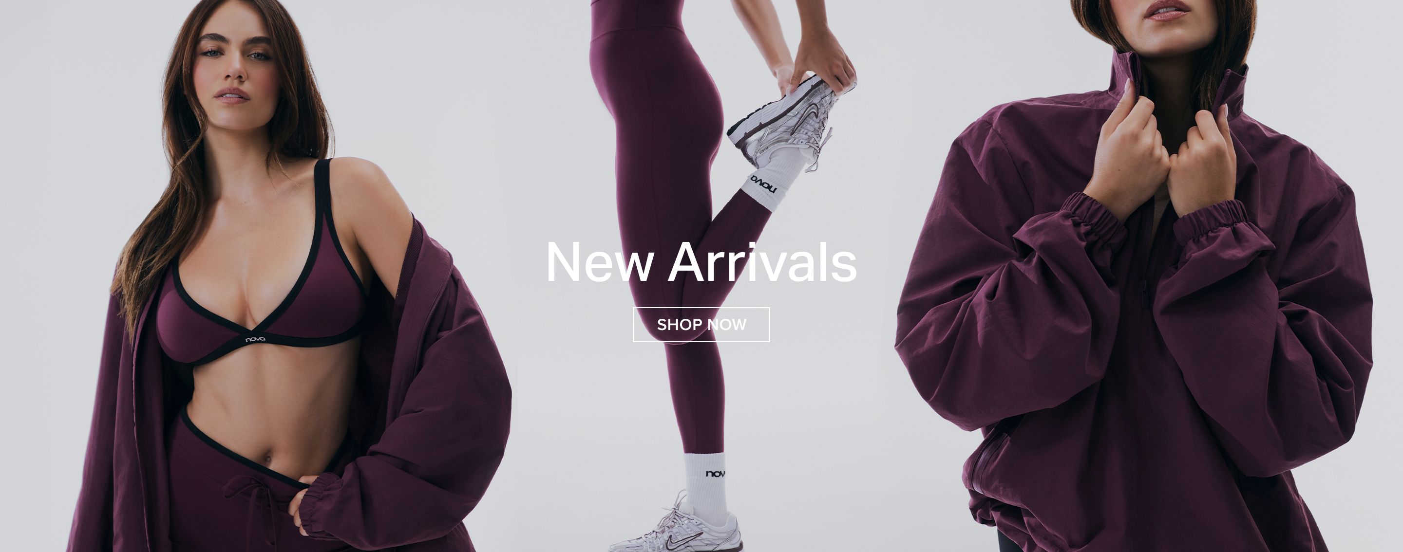 Models showcasing new plum activewear: sports bra, leggings, and track jacket. Shop the latest stylish workout clothes now!