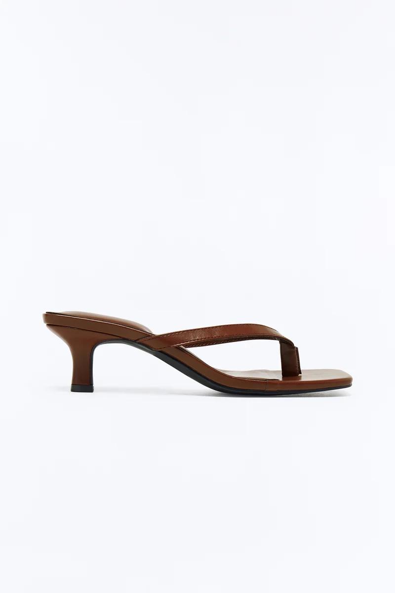 Brown leather kitten heel thong sandal with a square toe.