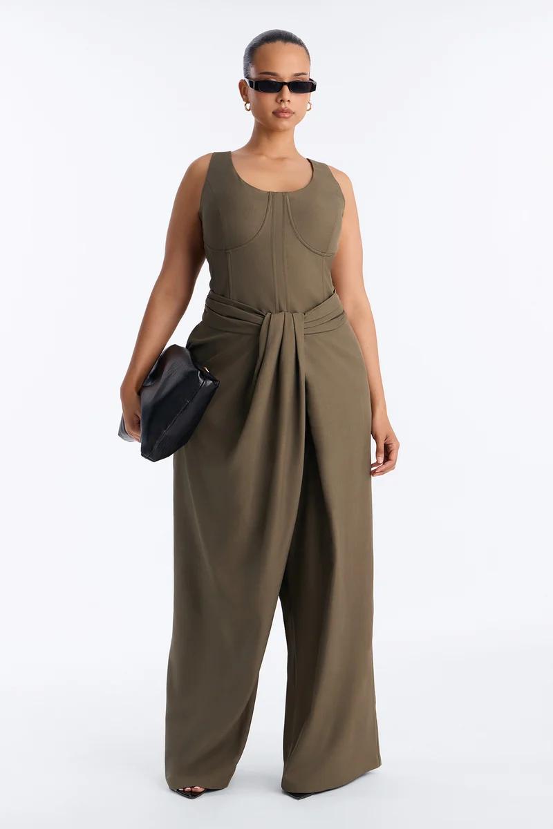 Stylish woman in charcoal grey square-neck bodysuit and wide-leg shorts, showcasing trendy plus size fashion from our new collection.