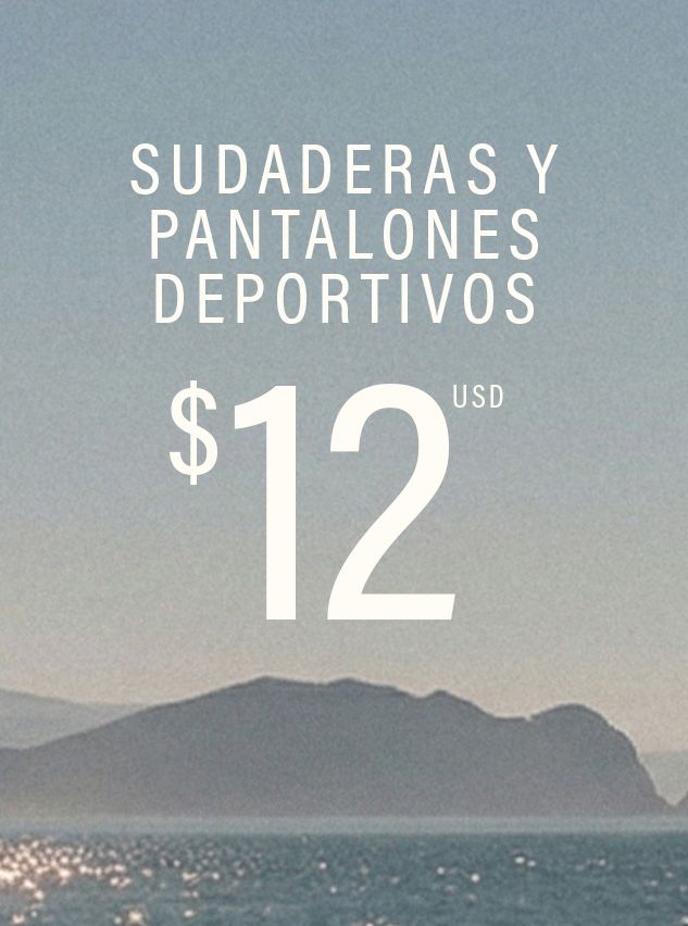 Fondo azul brumoso de montañas y océano con texto blanco 'Sudaderas y Pantalones Deportivos $12 USD', promocionando una oferta.