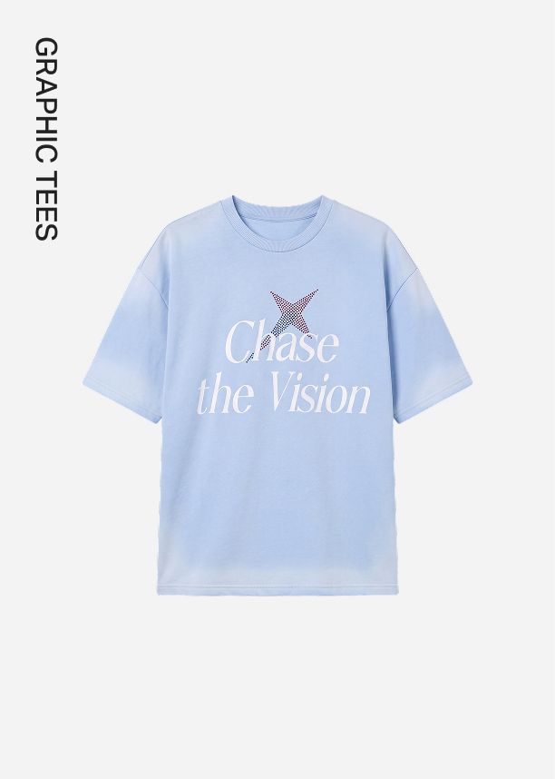 Light blue oversized graphic tee printed with 'Chase the Vision' white text, showcasing the brand's new casual graphic tees collection.