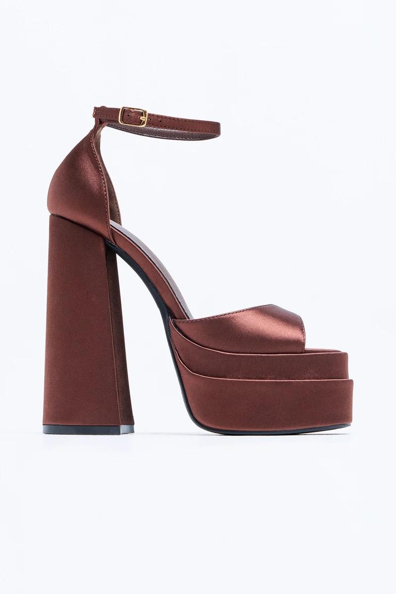 Brown satin platform block heel sandals with ankle strap.