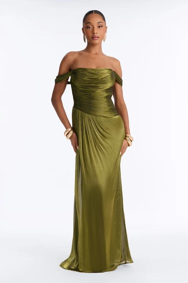 Model wearing an off-the-shoulder olive green gown with ruched bodice, showcasing the new elegant formal evening dress collection.