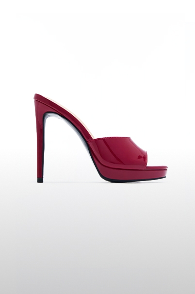 Bright red patent leather mule with a high stiletto heel and front platform, showcasing new stylish women's footwear for a chic look.
