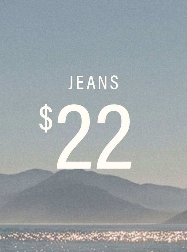 White text 'JEANS $22' over a misty blue-gray mountain landscape with sparkling water. Shop this incredible jeans offer now!