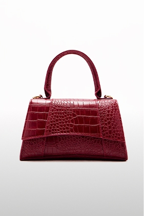 Elegant deep red crocodile-embossed top-handle bag with a structured silhouette, a luxurious addition to any fashion collection.