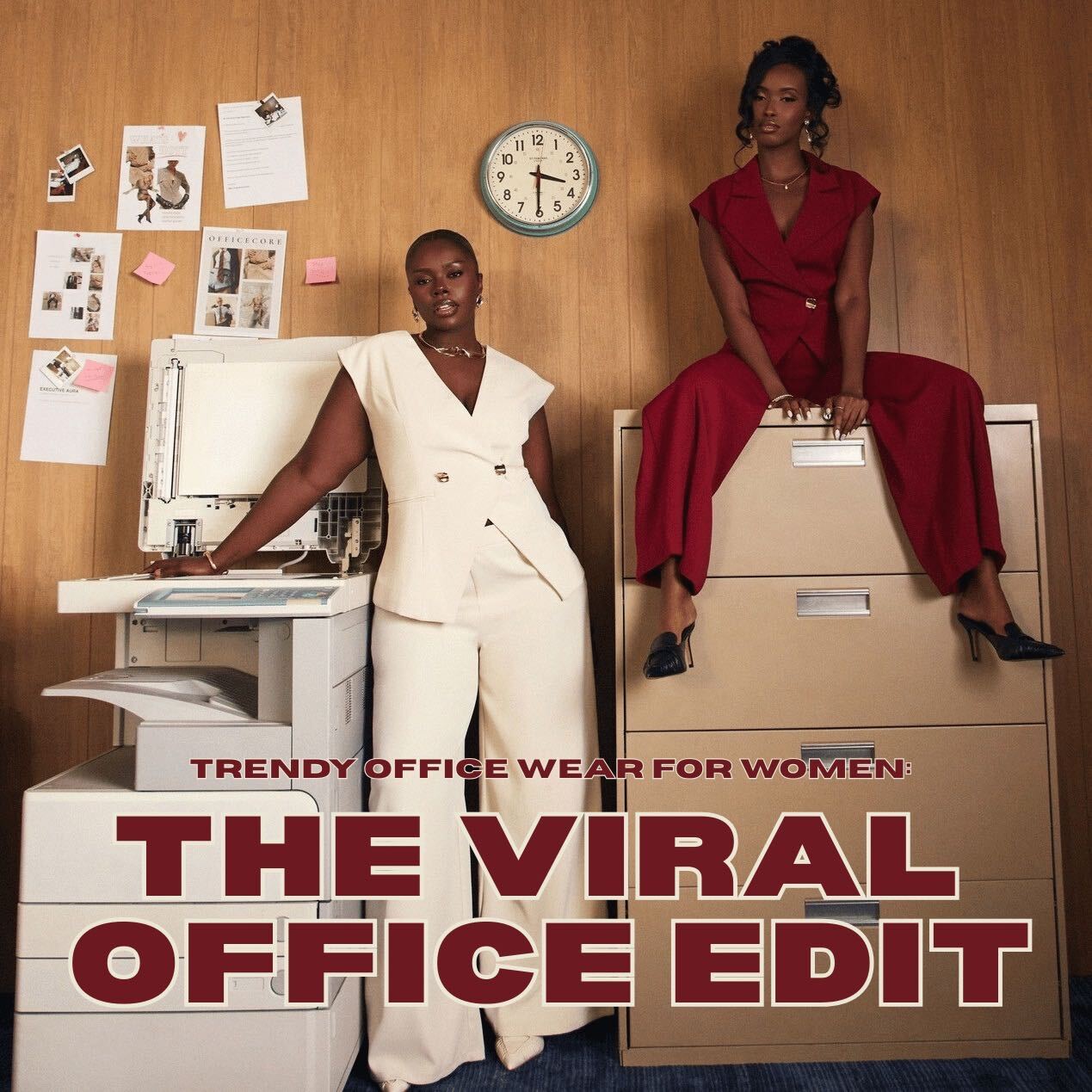 Two women pose in a retro office wearing a cream sleeveless suit and a red pantsuit, promoting a trendy office wear for women collection.