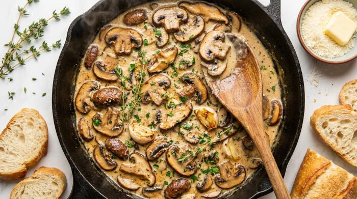 Rich, creamy mushroom sauce presented in a gravy boat.