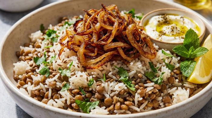 A bowl of warm Middle Eastern rice topped with crispy onions and fresh coriander.