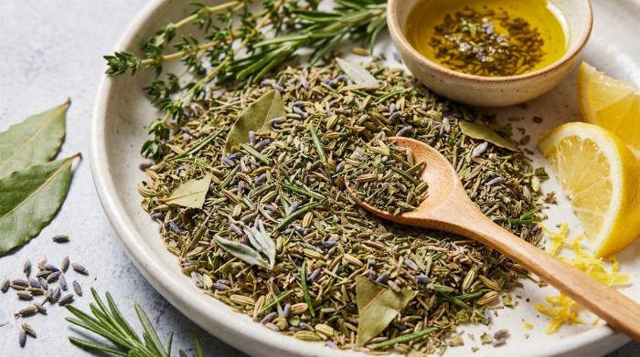 Close-up of a rustic dish filled with dried Herbes de Provence.