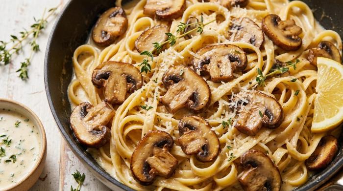 A steaming bowl of creamy mushroom pasta.