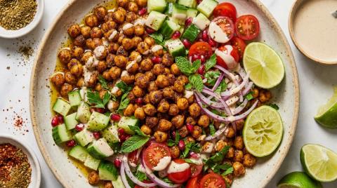 A vibrant Middle Eastern spiced chickpea salad served in a wide bowl.