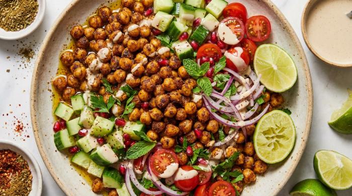 A vibrant Middle Eastern spiced chickpea salad served in a wide bowl.
