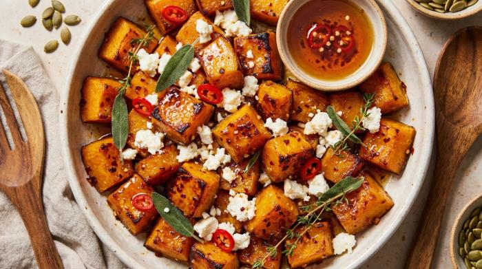 Golden chunks of roasted pumpkin topped with crumbled feta, walnuts, and fresh chili.