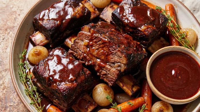 Braised beef short ribs served in a rich red wine sauce.