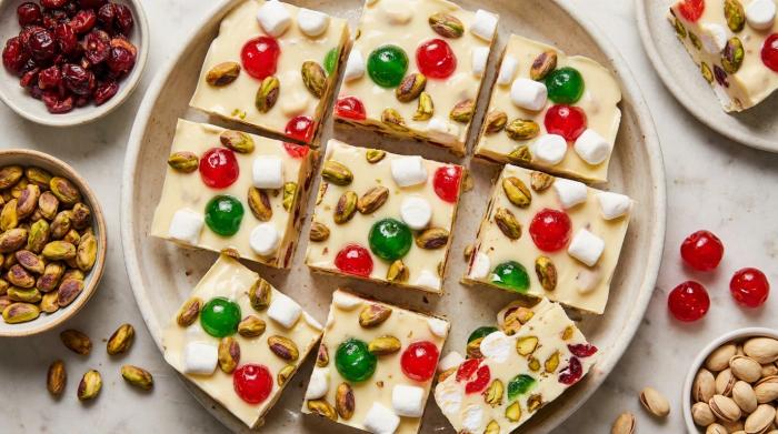 A thick slab of white chocolate rocky road filled with red cherries, green pistachios, and marshmallows.