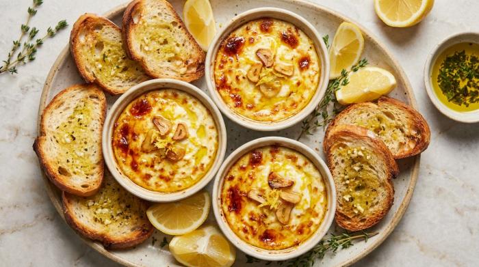 Golden brown baked ricotta in small dishes ready to be served.