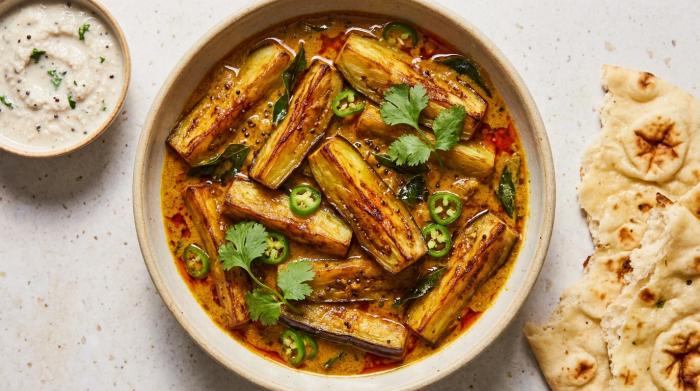 Thick eggplant curry served in a rustic bowl.