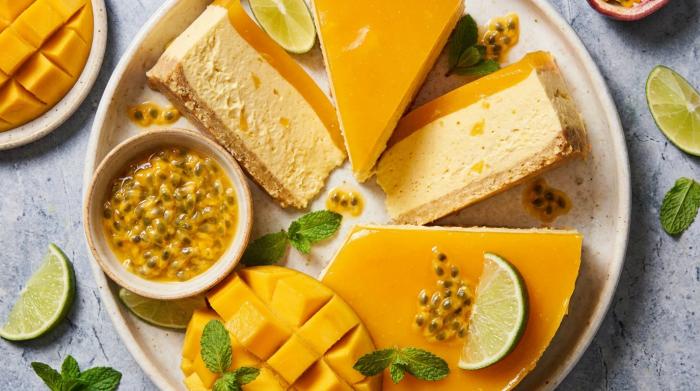 A fully decorated no bake mango cheesecake ready to serve