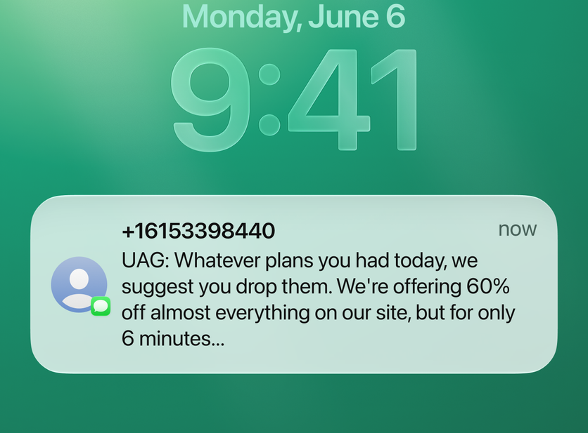 UAG Mega Sale SMS on a phone lock screen announcing 60% off for 6 minutes