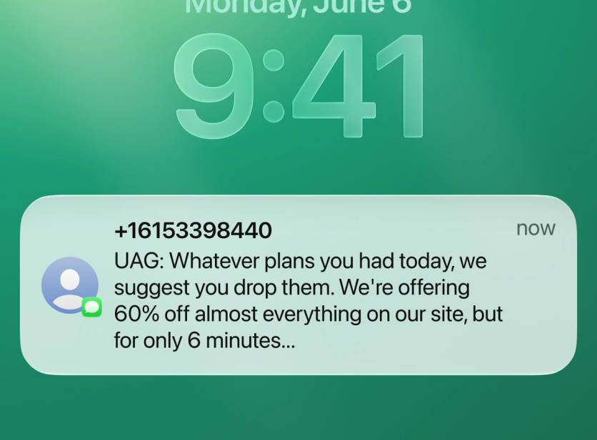 UAG Mega Sale SMS on a phone lock screen announcing 60% off for 6 minutes