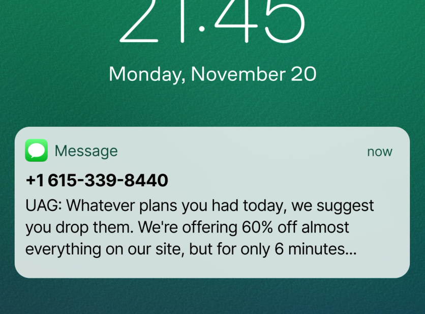 UAG Mega Sale SMS on a phone lock screen announcing 60% off for 6 minutes